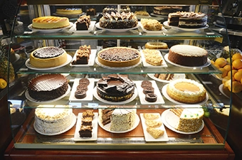 Restaurant Desserts variety at Symposium Cafe Dessert spots in Ontario showcasing cakes, and other dessert menu choices